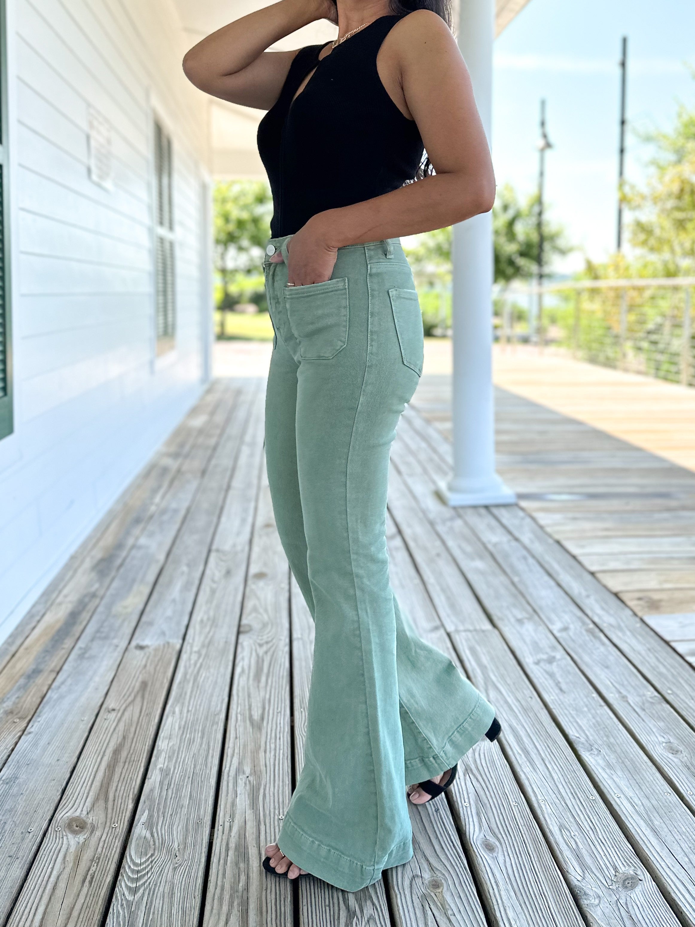 Green bell bottom jeans deals